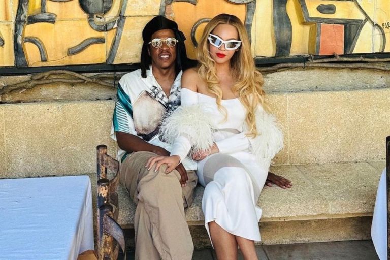 Fashion Bomb Couple:  Beyoncé Wore a White Feathered LaPointe Dress and Brandon Blackwood handbag with Jay-Z in Jil Sander while Exploring Nice, France