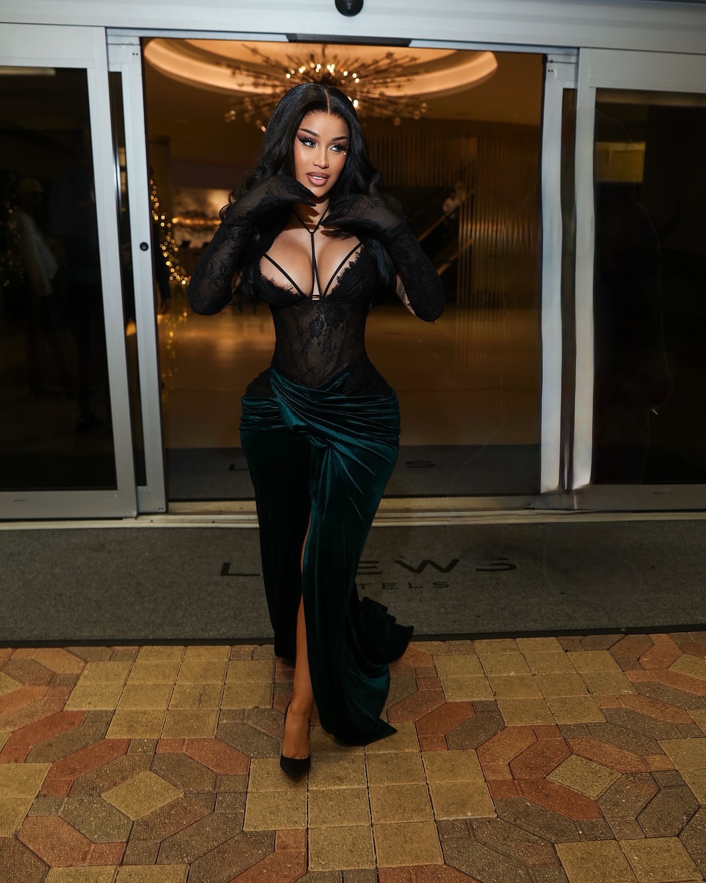 78 Cardi B Celebrates The New Year In A Mimoza Kadriaj Black Velvet Drape Gown And A Custom Jordon Wllis Pink And Green Lace Mini Dress