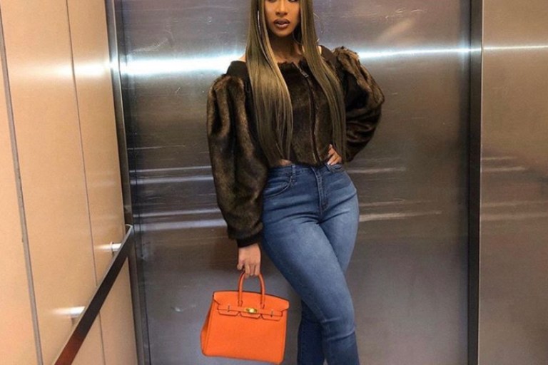 Get the Look: Cardi B’s All Star Weekend Game $1,350 Burberry Faux Fur Corset, DSquared2 Fur Boots, and Orange Hermes Birkin Bag