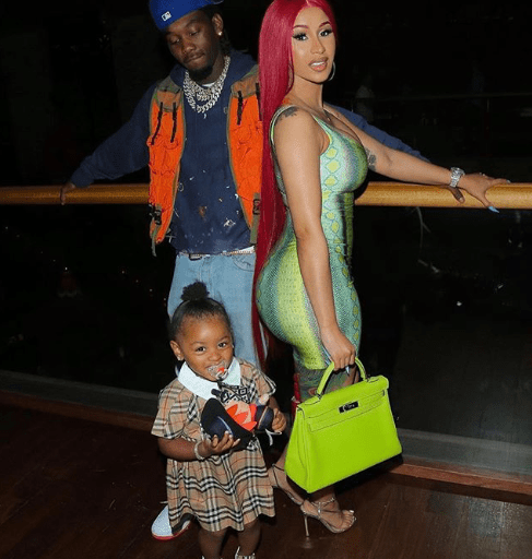 Cardi B Spends Fathers’s Day with Offset and Kulture in Adriana Sahar Neon Green and Blue Snake Print Dress